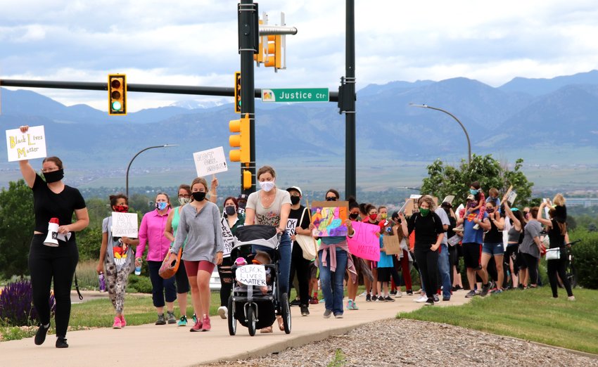 Organizer Alex Morgan of Northglenn leads a group of 65 people on a short walk from Northglenn's Justice Center along Community Center Drive to E. B. Rains Park June 6. The march was a protest calling for racial justice.